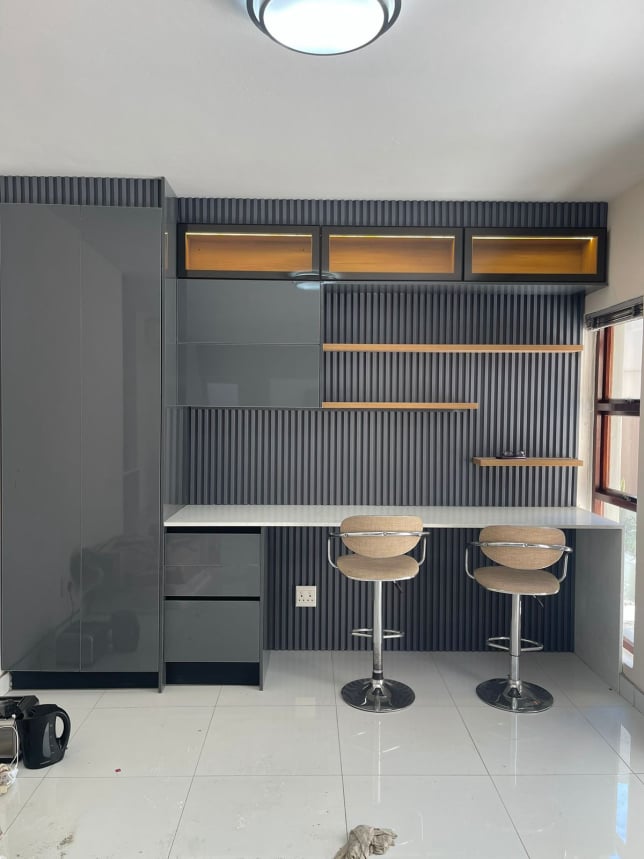 Slatted bar and kitchenette with floating shelves